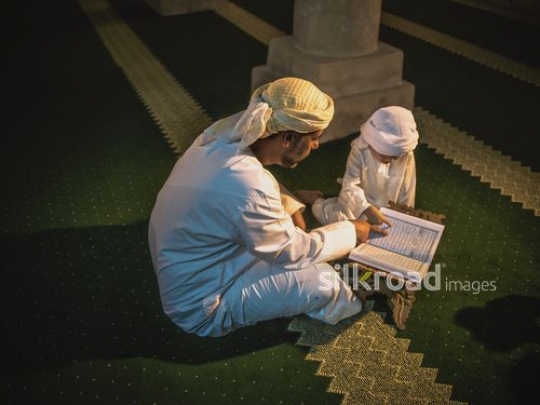 Old man with little boy reading qur'an|-