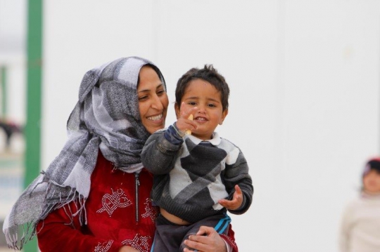 Syrian women with her child from Zaatari refugee camp for Syrian refugees