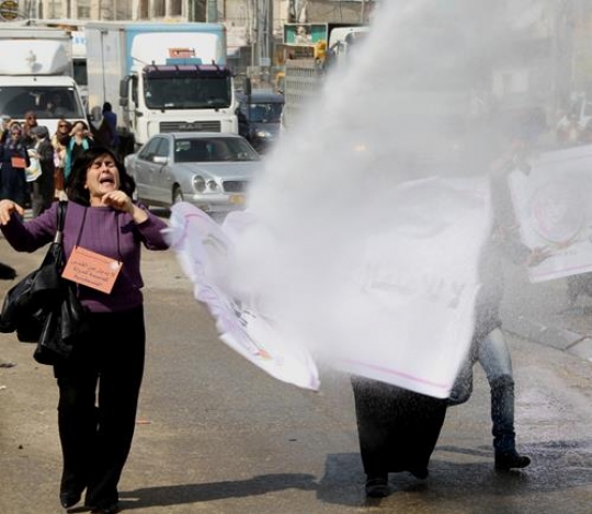 palestinian woman affected by tear gas