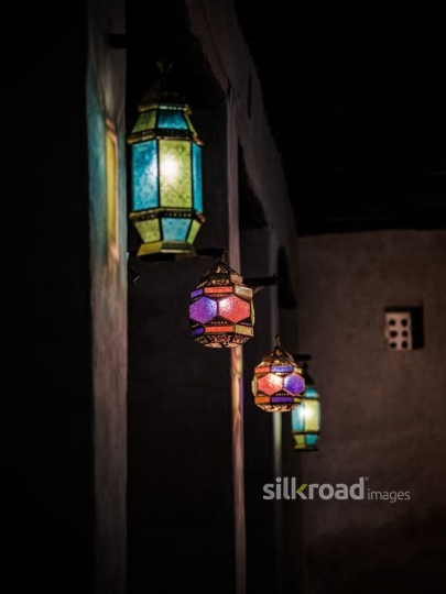 Colourful lanterns hanging on the wall|-