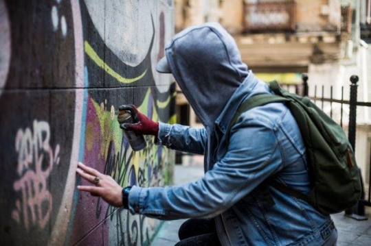 Graffiti Guy Spraying on Wall in Karakoy - Karaköy Istanbul