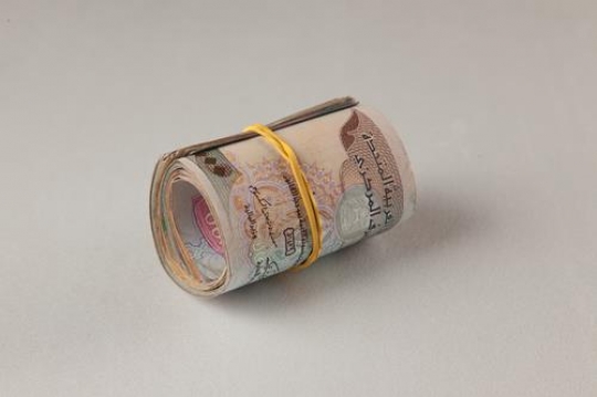 an uae dirhams rolled up