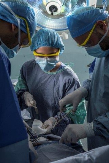 Surgeons Running an Operation