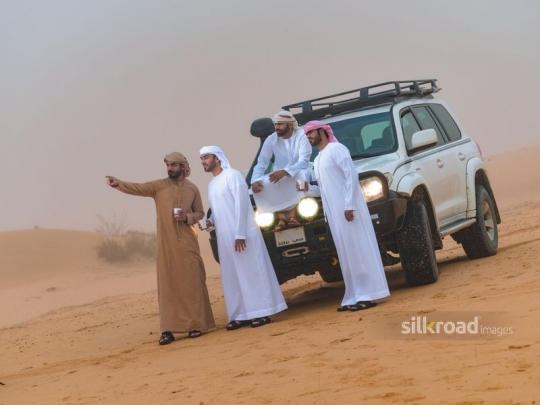 Men taking a break in the desert