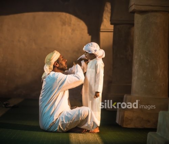 Boy with grandfather at the mosque|-