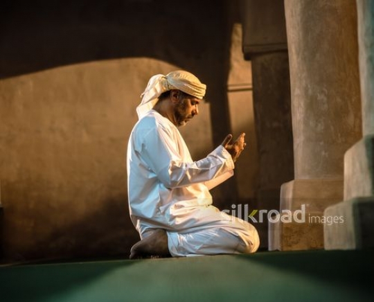 Old man praying t the mosque|-