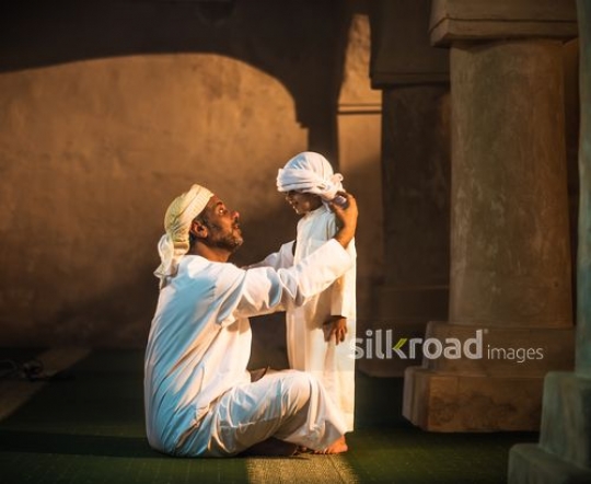 Boy with grandfather at the mosque|-