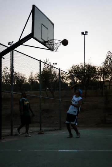 men playing basketball on court