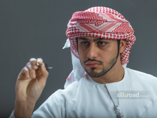 Arabian man focusing on target
