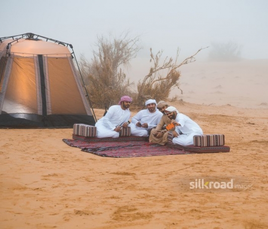 Guys taking a selfie in the desert