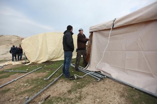 Men Building Tent at Bab al-shams Camp