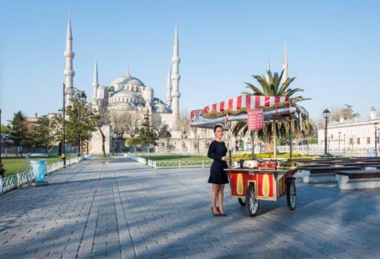 Businesswoman Selling Chestnut (Kestane) by Sultan Ahmad Mosque in Istanbul