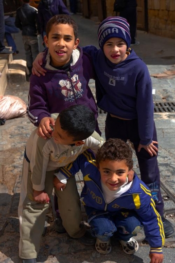 Four boys playing together in the town of Salt in Jordan.