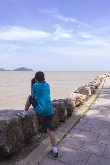 kid taking photo with a camera