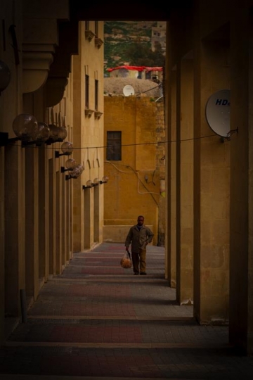 -Man walking in downtown Al-Salt