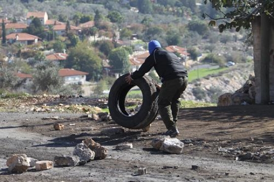 young man holding tire