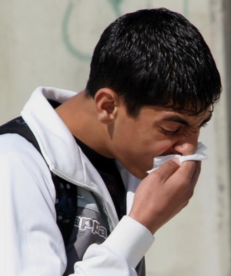 palestinian man affected by tear gas