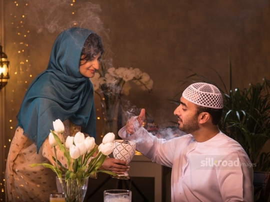 Wife is perfuming husband|-