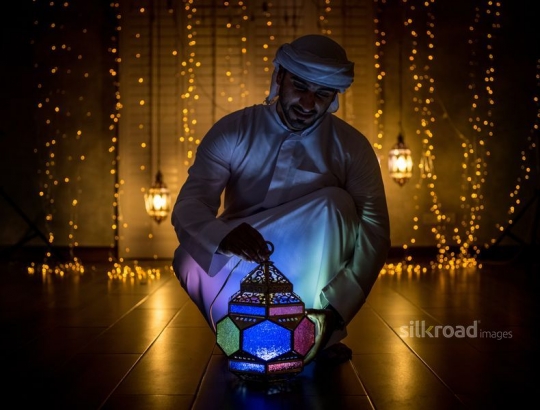 Man holding lantern|-