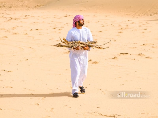 Man fetching wood