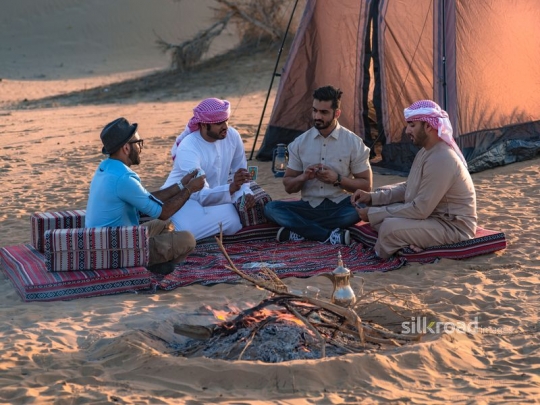 Friends gathering and playing cards