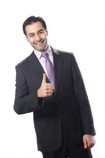 Cheerful businessman making th