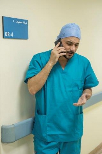 A Surgeon Making a Phone Call 
