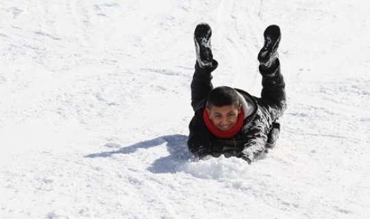 Boy playing in snow