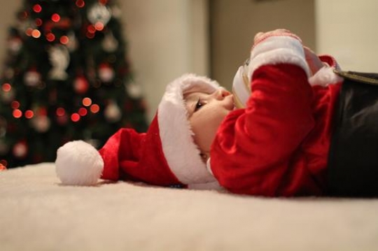 baby drinking form a bottle