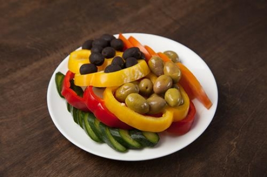 olives,capsicum and cucumber in a plate