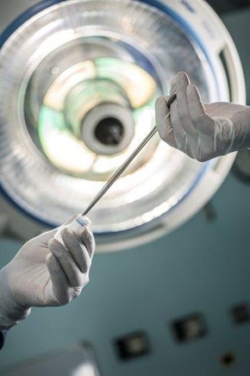 A Surgeon Holding Scissors and