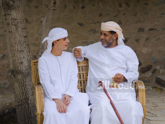 Grandfther in conversation with grandson|-