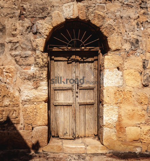Ancient Wooden Door at a Historical Church in Madaba, Jordan