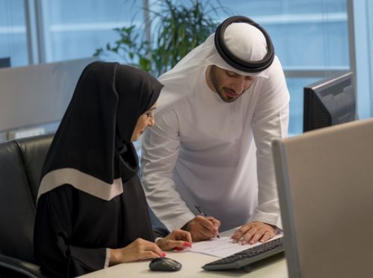 Business woman and businessman at the office working together|