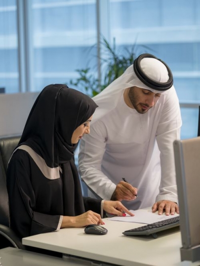 Business man and woman at the office working together|
