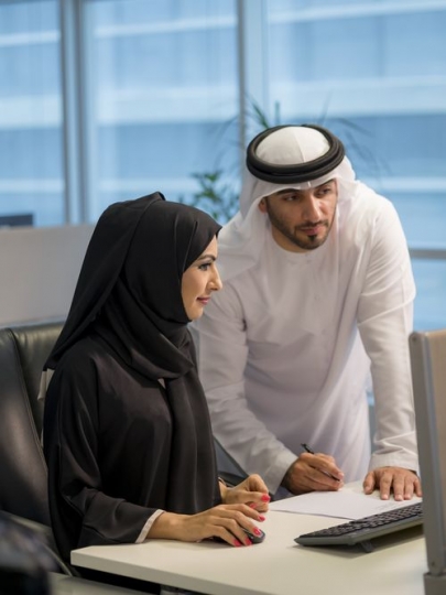 Businessman and woman at the office working|