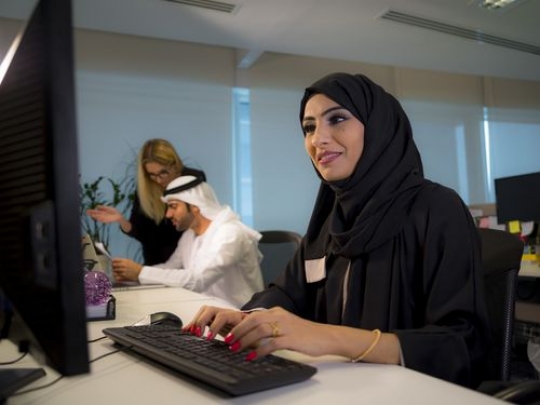 Business woman working by her desk|