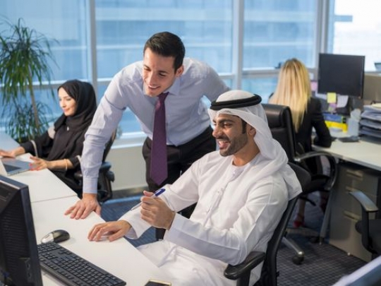 Business men at the office communicating with each other|