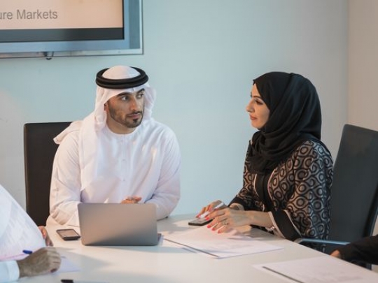 Arab Businessman and business woman during a meeting at the office|-