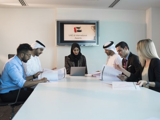 Employees during an office meeting|-