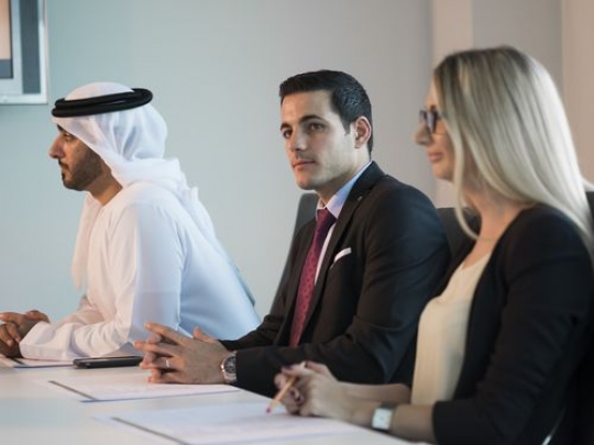 Businesspeople during a meeting|-