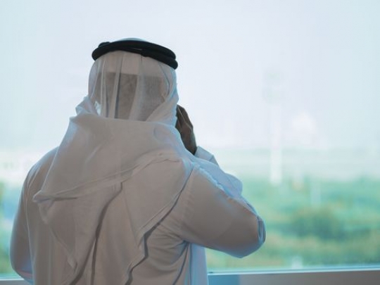 Employee making a phone call by the window|-