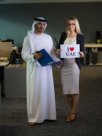 Two employees celebrating National Day at the office|-