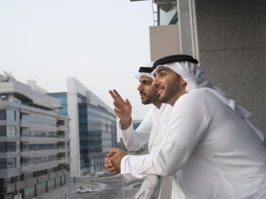 Two Business men standing outside |-