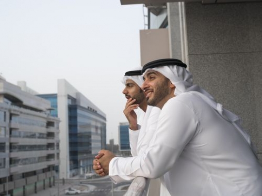 Two businessmen spending time on the balcony|-