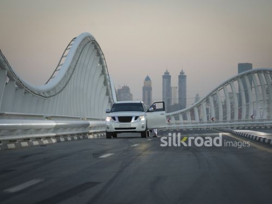 Arab man stepping out of his car|-
