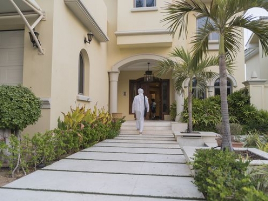 Arab man and father walking towards the door|-