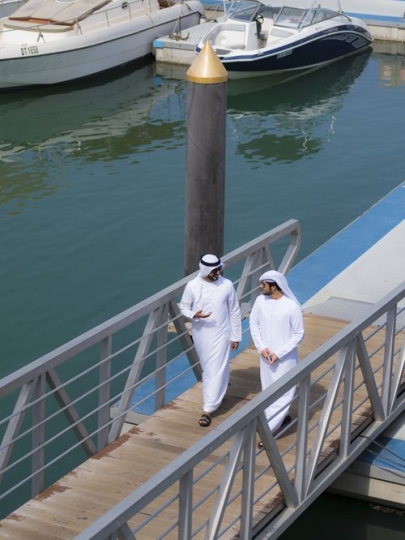 Top View of two arab men walking on the dock|-