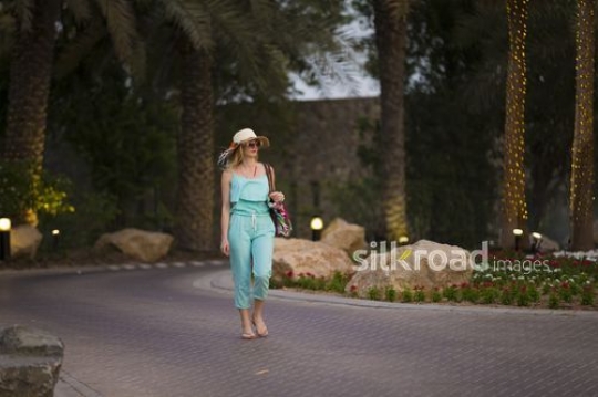 Western woman walking at the resort|-