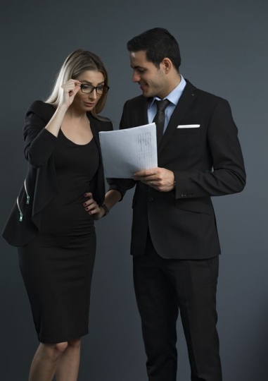 Business people standing and talking to each other|